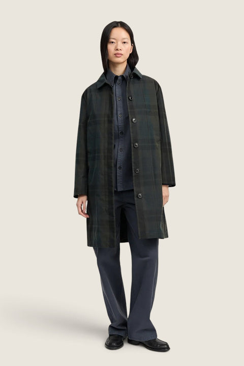 Bolina Noor coat in dark check pattern with a waxed finish, featuring a straight fit and hidden button closure.