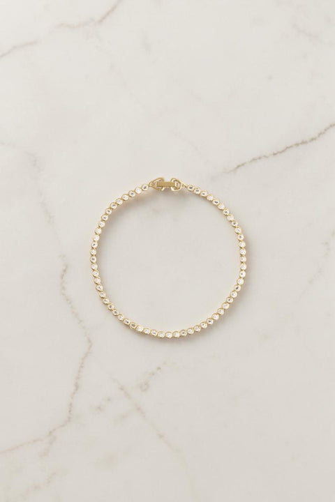 Bolina Orit Bracelet Gold, a thin tennis bracelet with small clear stones and a gold clasp.
