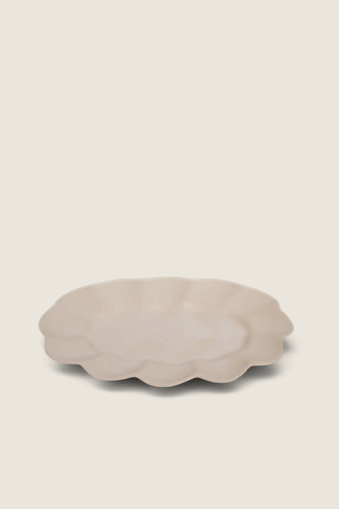 Bolina Paul stoneware dish in white with a soft wavy edge and a thin, handmade-style profile.