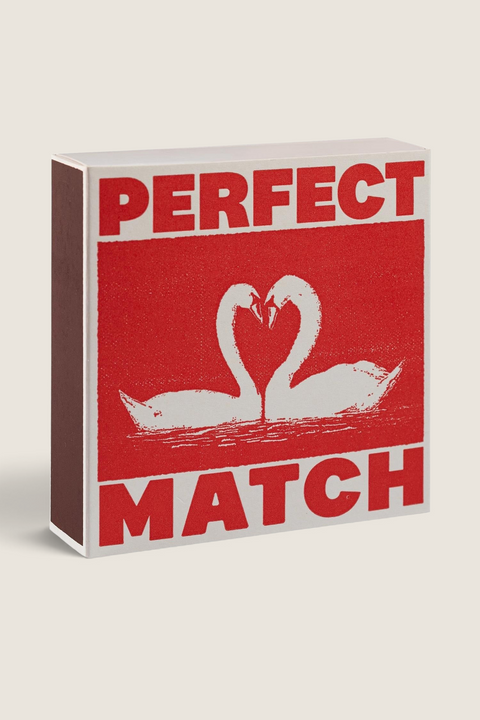 Bolina matchbox featuring two white swans forming a heart with Perfect Match text in red letterpress print
