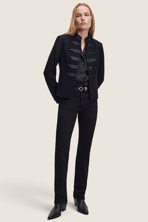 Bolina model wearing Rag & Bone black Sutton slim cigarette jeans with a black military-style jacket and boots