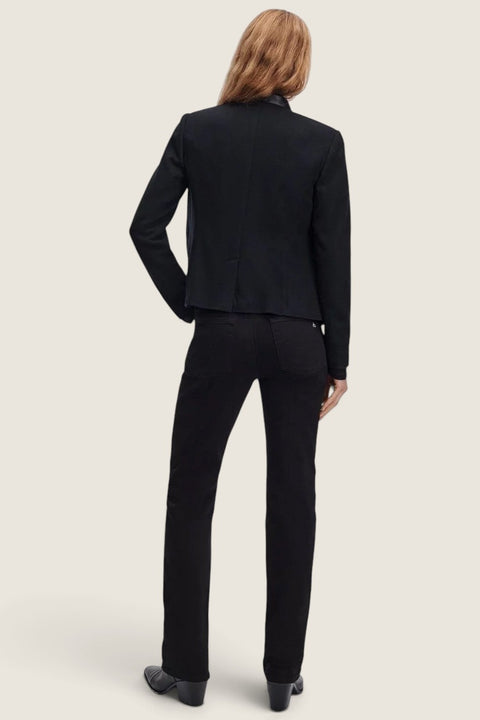 Bolina Rag & Bone Sutton black slim cigarette jeans worn with a black jacket, back view