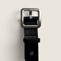 Bolina Rag & Bone Stanton black leather belt with a square silver-toned buckle, shown in a close-up view.