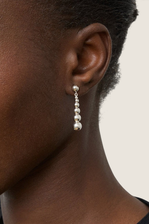 Bolina The Rebecca silver drop earrings featuring a delicate chain of polished spheres of varying sizes.
