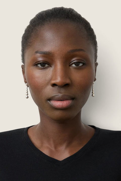 Bolina Rebecca silver drop earrings featuring polished spheres of varying sizes worn by a model