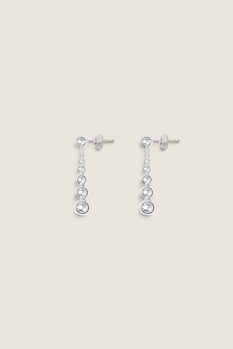 Bolina Rebecca silver drop earrings featuring a delicate chain of polished spheres in varying sizes.