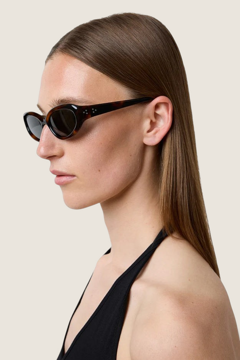 Bolina Robyn cat-eye sunglasses in dark tortoise shell pattern worn by a woman in profile view