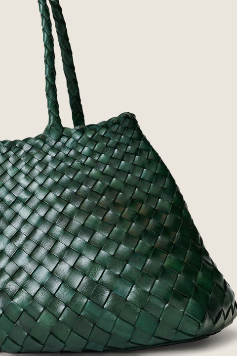 Bolina Santa Croce forest green woven leather tote bag with braided handles and an open top design.