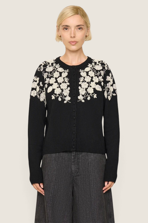 Bolina Shiloh black wool cardigan featuring white floral bead embroidery on the shoulders and chest.