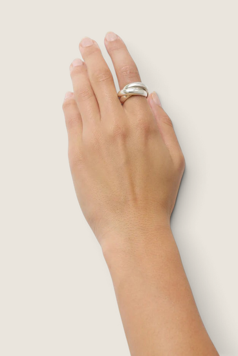 Bolina Sofie silver ring with a sculptural, overlapping design and polished finish worn on a hand.