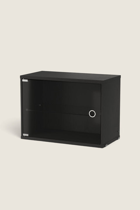 Bolina String display cabinet in black ash veneer with a hinged glass door and internal glass shelf