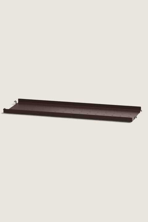 Bolina String metal shelf in dark brown with a low edge and perforated surface for flexible storage solutions.