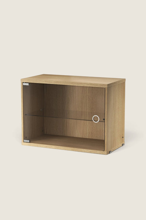 Bolina String display cabinet in oak veneer with a hinged glass door and internal shelf for modular shelving systems.