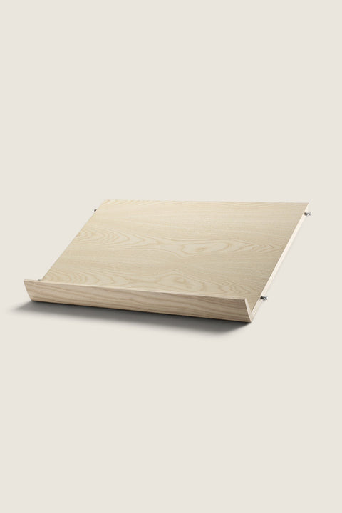 Bolina String System magazine shelf in light ash wood veneer, 58x30 cm, designed for display of books and magazines.