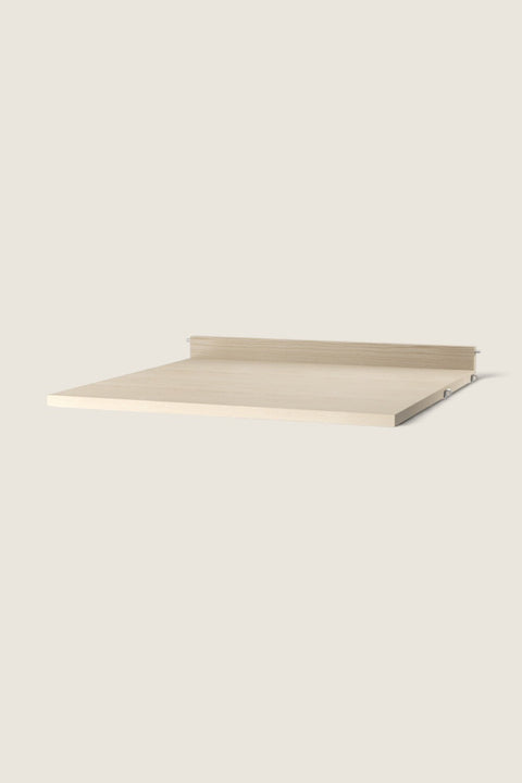 Bolina String System work desk shelf in light ash veneer with a natural wood grain texture and wall-mounting edge.