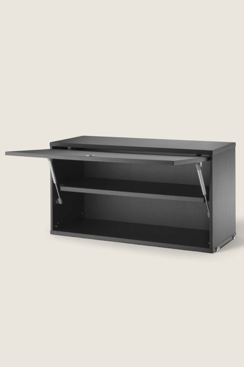 Bolina String System flip door cabinet in black ash veneer with an adjustable inner shelf and modern storage design.