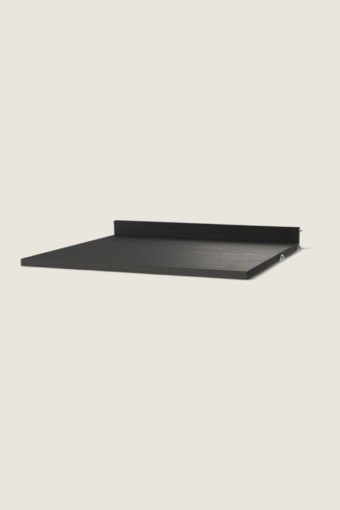 Bolina String System work desk shelf in black ash veneer with a visible wood grain texture and a back edge.