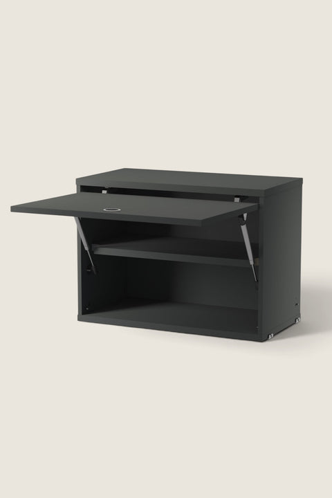 Bolina String System dark grey cabinet with a drop-down door and adjustable internal shelf for modular storage.