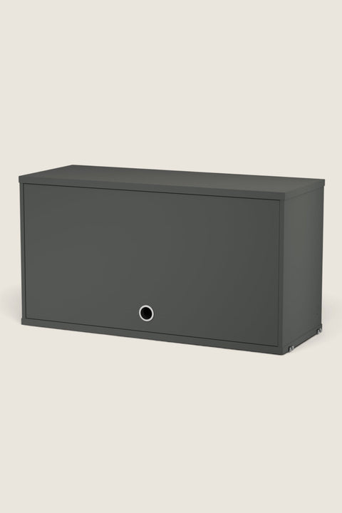 Bolina String System dark grey cabinet with a drop-down door and circular handle for modular wall shelving.