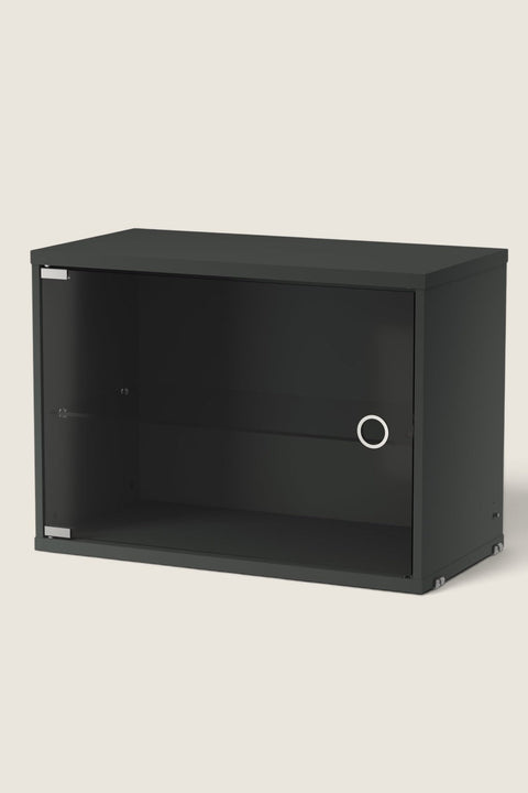 Bolina String System display cabinet in dark grey with a hinged glass door and internal shelf.