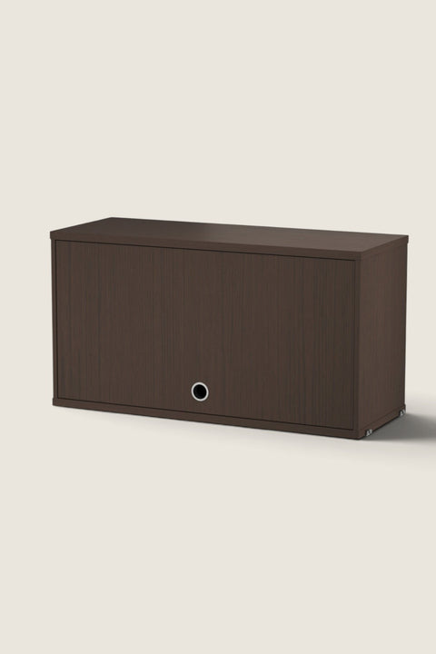 Bolina String System flip door cabinet in dark oak wood finish with a circular silver handle