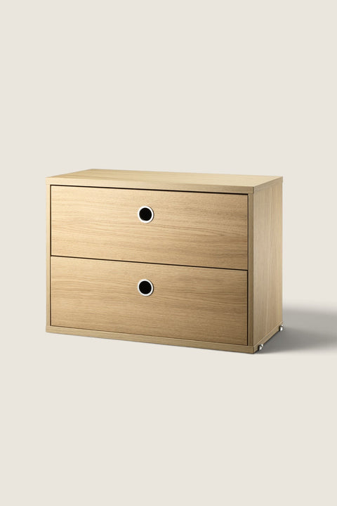 Bolina String System oak veneer drawer unit with two drawers and circular metal pulls for modular shelving storage.