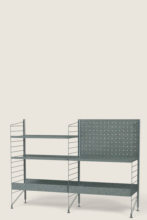 Bolina String System Outdoor K galvanized metal shelving unit with high and low edge shelves and a perforated backboard.