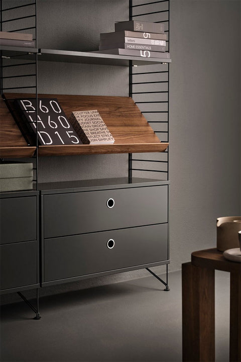 Bolina String System shelving unit with dark grey drawers, black wire side panels, and a wooden display shelf.