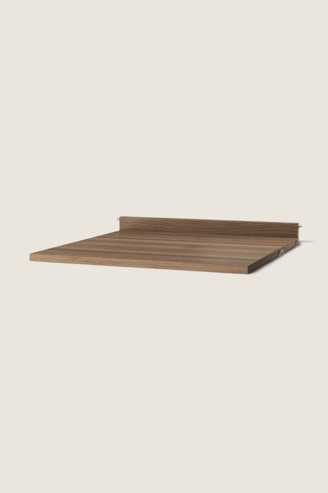 Bolina String System walnut work desk shelf with a warm wood grain finish and a low back edge for stability