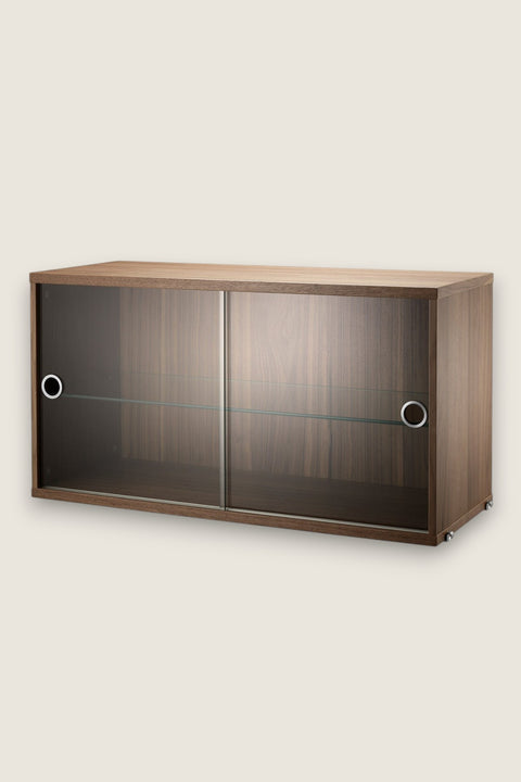 Bolina String System walnut cabinet with sliding glass doors and internal shelf for modular shelving units.