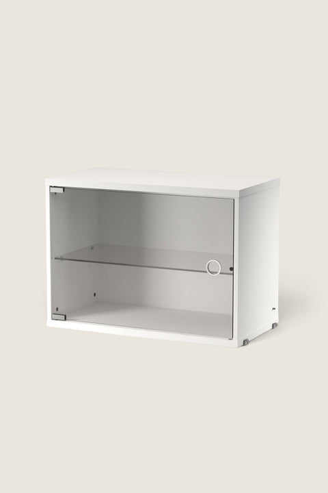Bolina String white display cabinet with a hinged glass door and internal glass shelf for modular shelving systems.