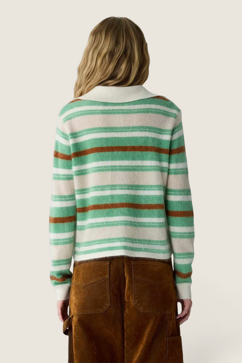 Back view of a woman wearing a Bolina striped cashmere rugby sweater in Highland Combo with a polo collar.