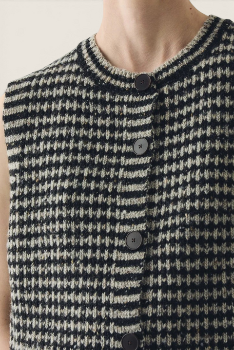 Bolina striped Donegal merino wool buttoned vest in flax and charcoal with a round neck and ribbed trim