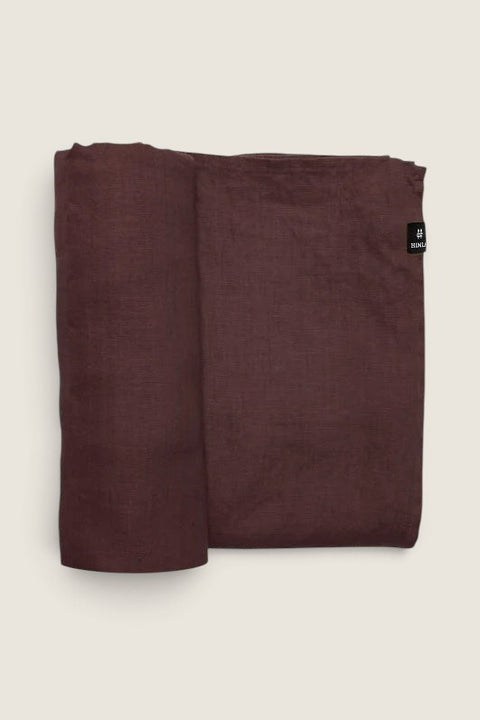 Bolina Sunshine burgundy linen tablecloth with a washed, textured finish and Himla brand label.