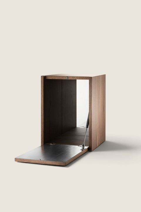 Bolina Tiny walnut cabinet for String System with a brushed stainless steel lid and mirrored back panel.