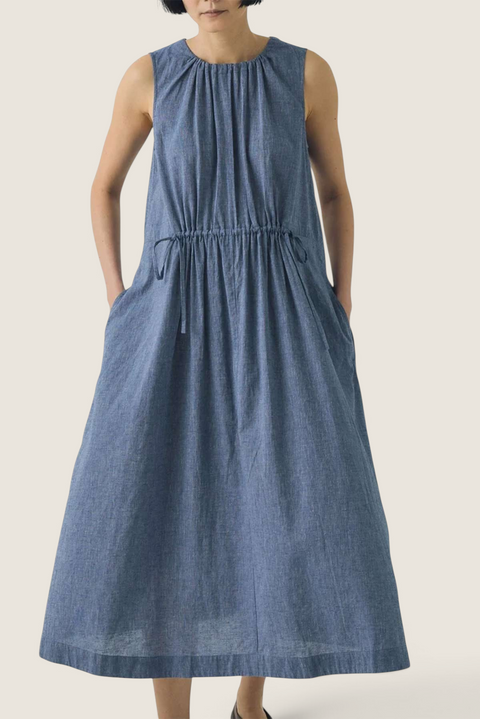 Bolina TOAST chambray blue cotton linen midi dress with adjustable drawstring waist and side pockets on a model