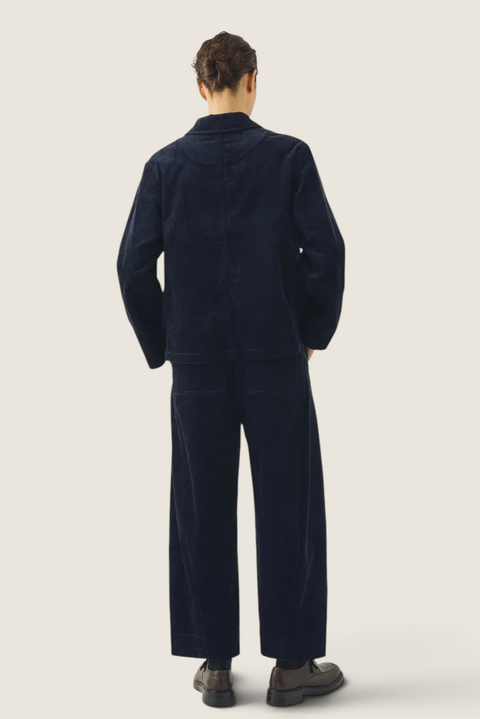 Bolina TOAST dark navy organic cotton corduroy trousers with barrel-leg fit and twisted seams, back view