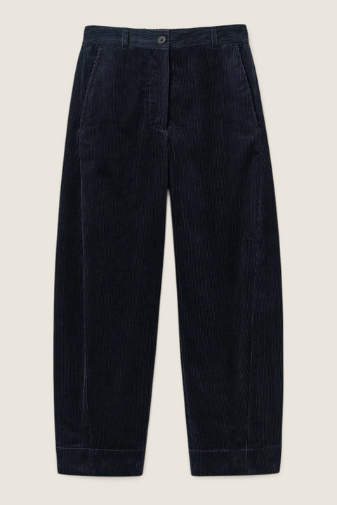 Bolina TOAST dark navy corduroy trousers with a high waist, barrel-leg silhouette, and unique twisted seam detail.