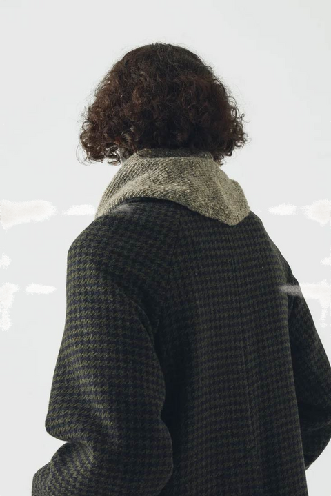Bolina TOAST Donegal Merino bandana scarf in stone grey worn around the neck over a dark patterned coat