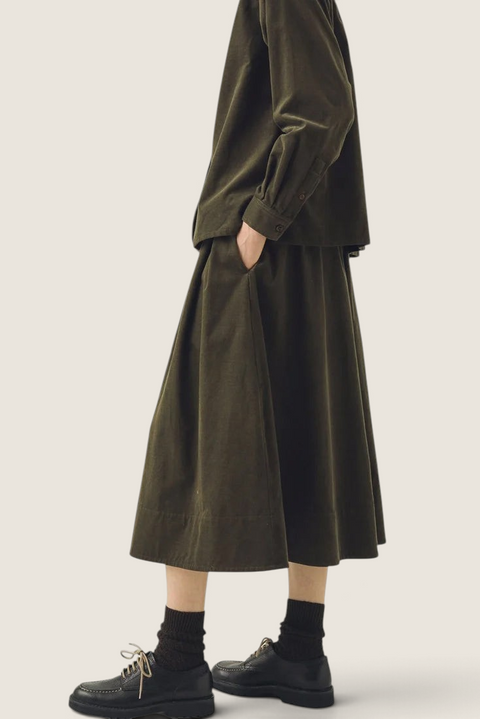 Bolina TOAST seaweed green A-line needlecord cotton skirt with side pockets worn by a model