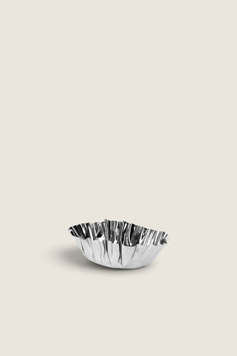 Bolina Tydra bowl in mirror-polished stainless steel with a wavy, organic design for modern table decor.
