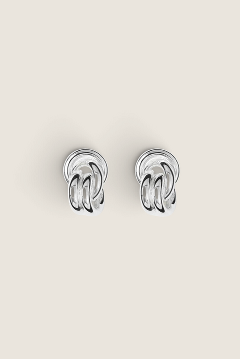 Bolina Vera silver earrings by LIÉ STUDIO featuring a sculptural knot design with a polished metallic finish.