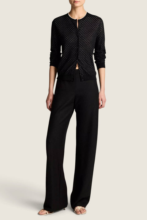 Bolina Vince black cardigan with off-white dot motif, crew neck, and button-down front worn with black trousers.