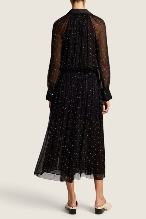 Bolina Vince black chiffon midi skirt with white polka dots, gathered waist, and sheer long sleeves, back view.