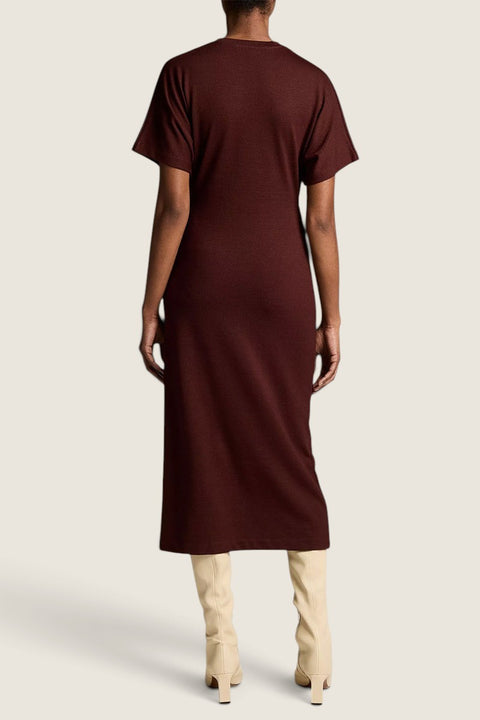 Bolina Vince black rose knit midi dress with short dolman sleeves, back view on a model wearing cream boots