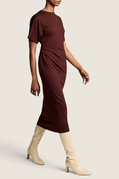 Bolina Vince black rose knit midi dress with short dolman sleeves and side ruching worn with cream heeled boots