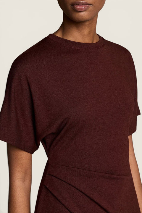 Bolina Vince black rose knit dress with short dolman sleeves and side ruching detail on a model