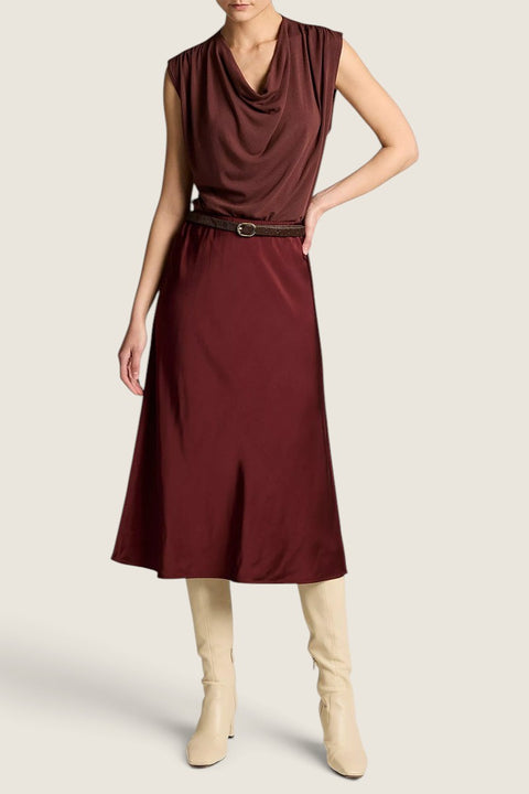Bolina Vince matte satin slip skirt in black rose paired with a matching cowl neck top and cream knee-high boots.