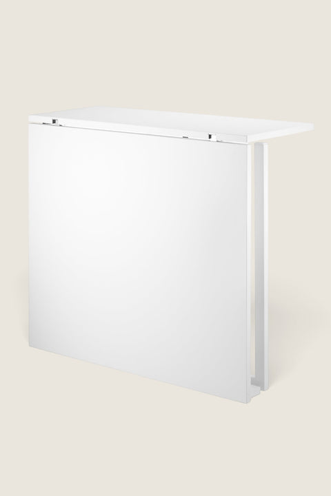 Bolina white foldable table for String System shown in the folded down position against a white background.