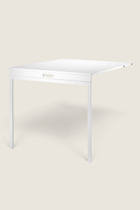 Bolina white foldable table for String System, a space-saving wall-mounted desk solution for small rooms.